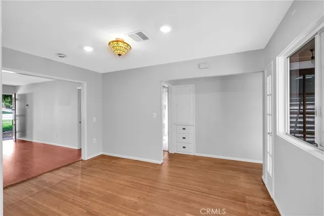 a kitchen with granite countertop a refrigerator and a sink