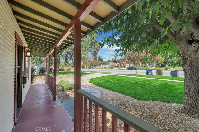 a view of a garden with a house