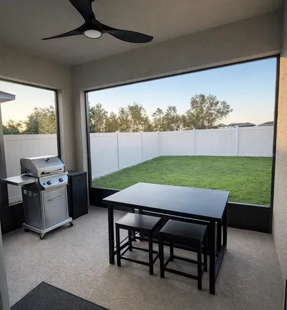 a front view of a house with a garden and plants
