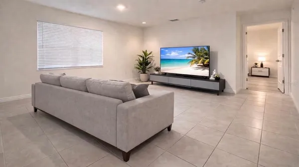 a bedroom with a bed and a night stand