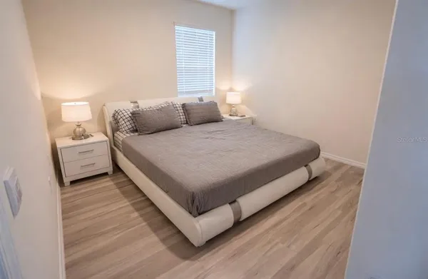 a view of a room with wooden floor