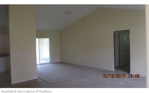 4441 Loquat Road Sebring, FL 33875 - Photo 3 of 6 a view of an empty room and a window