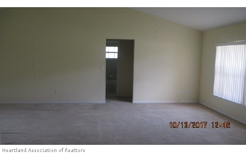 4441 Loquat Road Sebring, FL 33875 - Photo 4 of 6 a view of an empty room and window