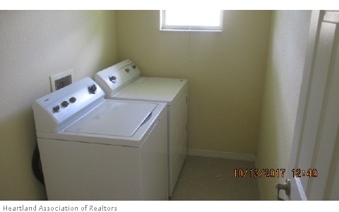 4441 Loquat Road Sebring, FL 33875 - Photo 5 of 6 a utility room with dryer and washer
