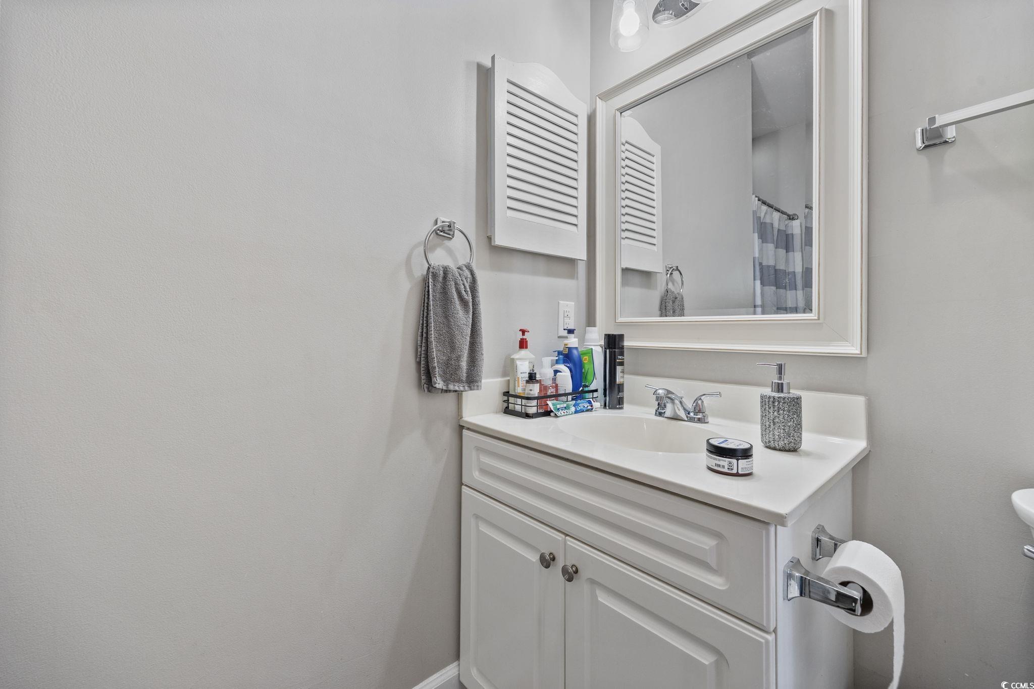 4639 Wild Iris Drive, Unit 203 Myrtle Beach, SC 29577 - Photo 17 of 30 Full bath with a shower with shower curtain and vanity