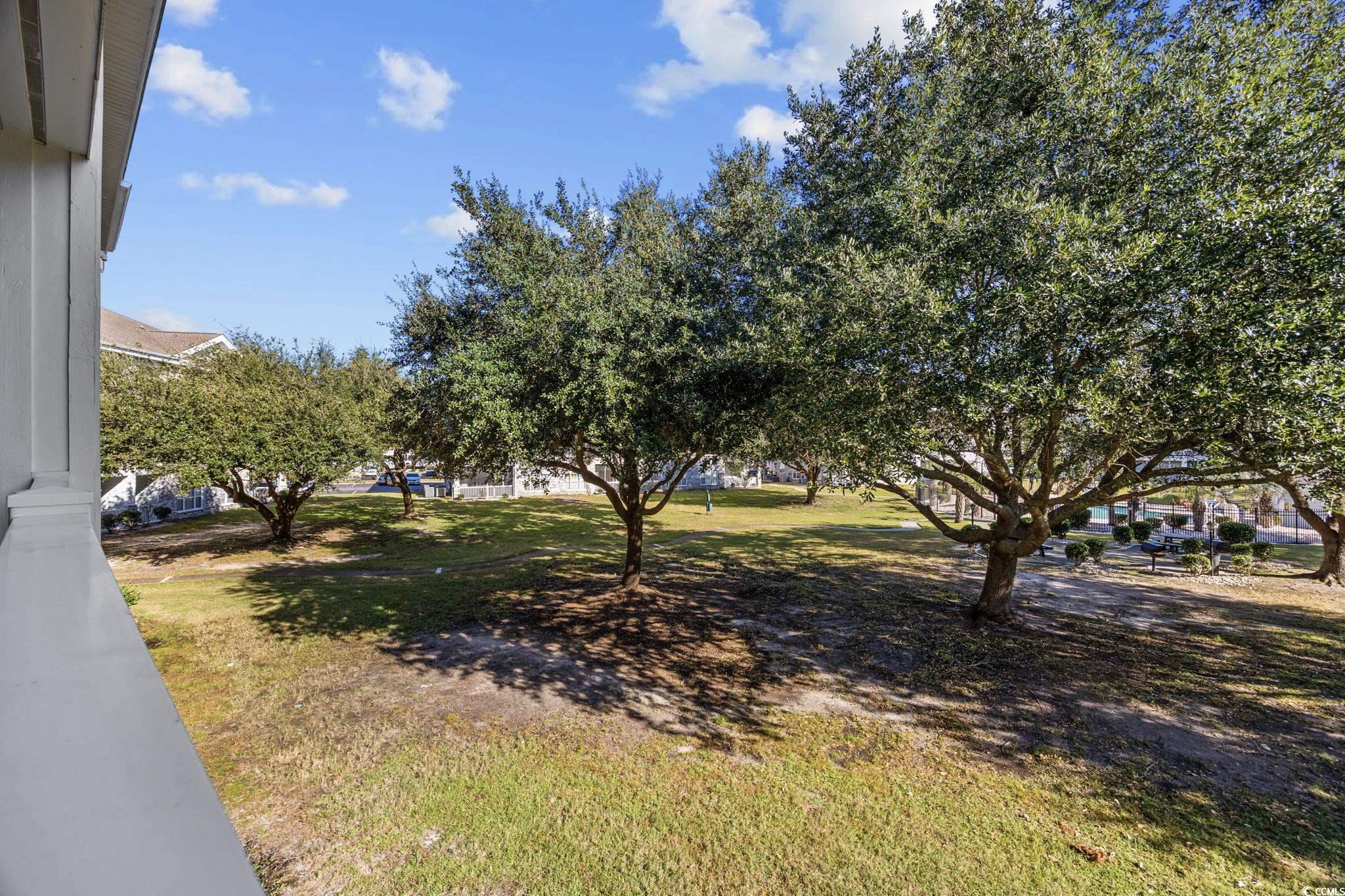 4639 Wild Iris Drive, Unit 203 Myrtle Beach, SC 29577 - Photo 22 of 30 View of green lawn
