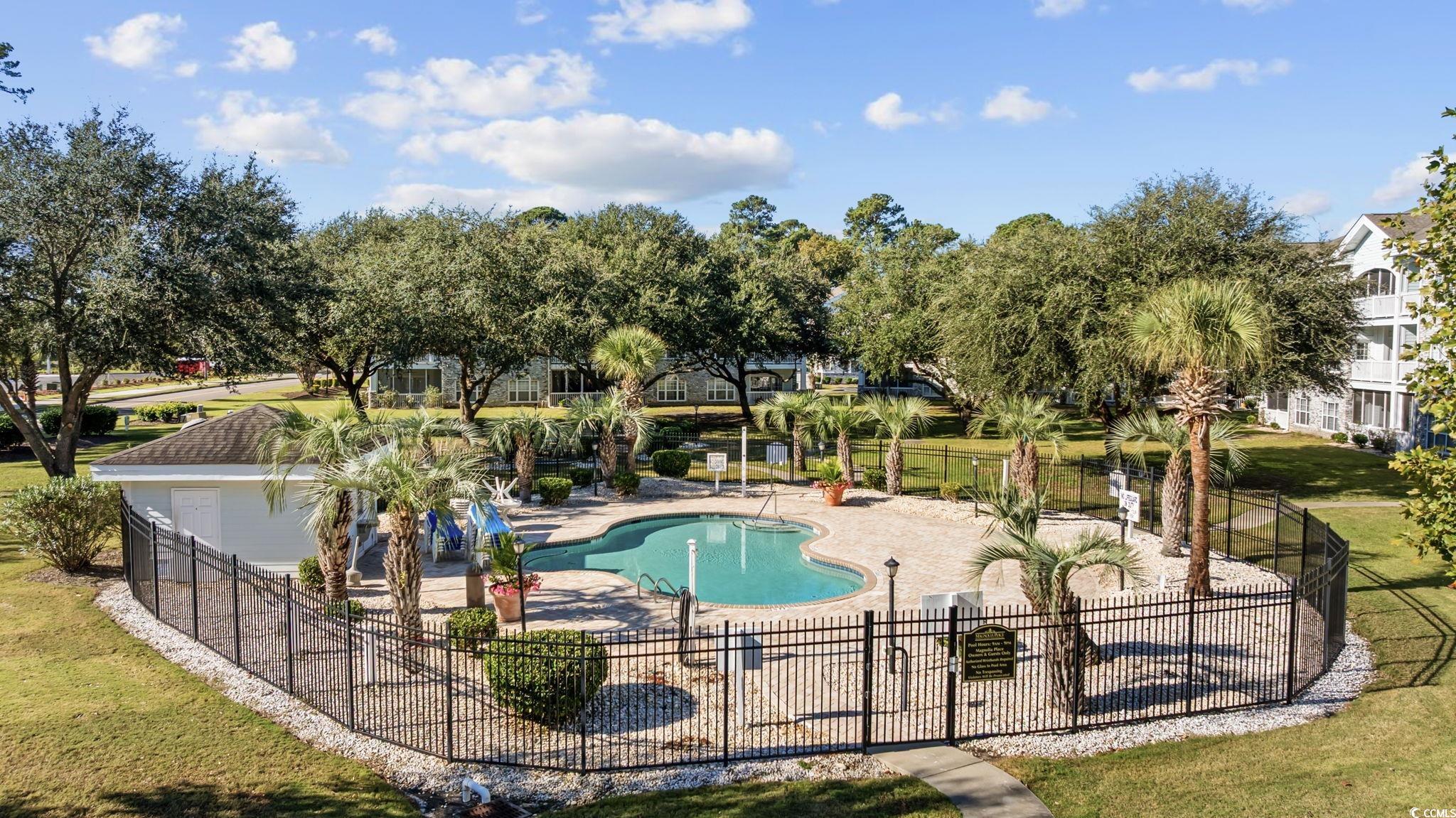 4639 Wild Iris Drive, Unit 203 Myrtle Beach, SC 29577 - Photo 25 of 30 Community pool featuring a patio area