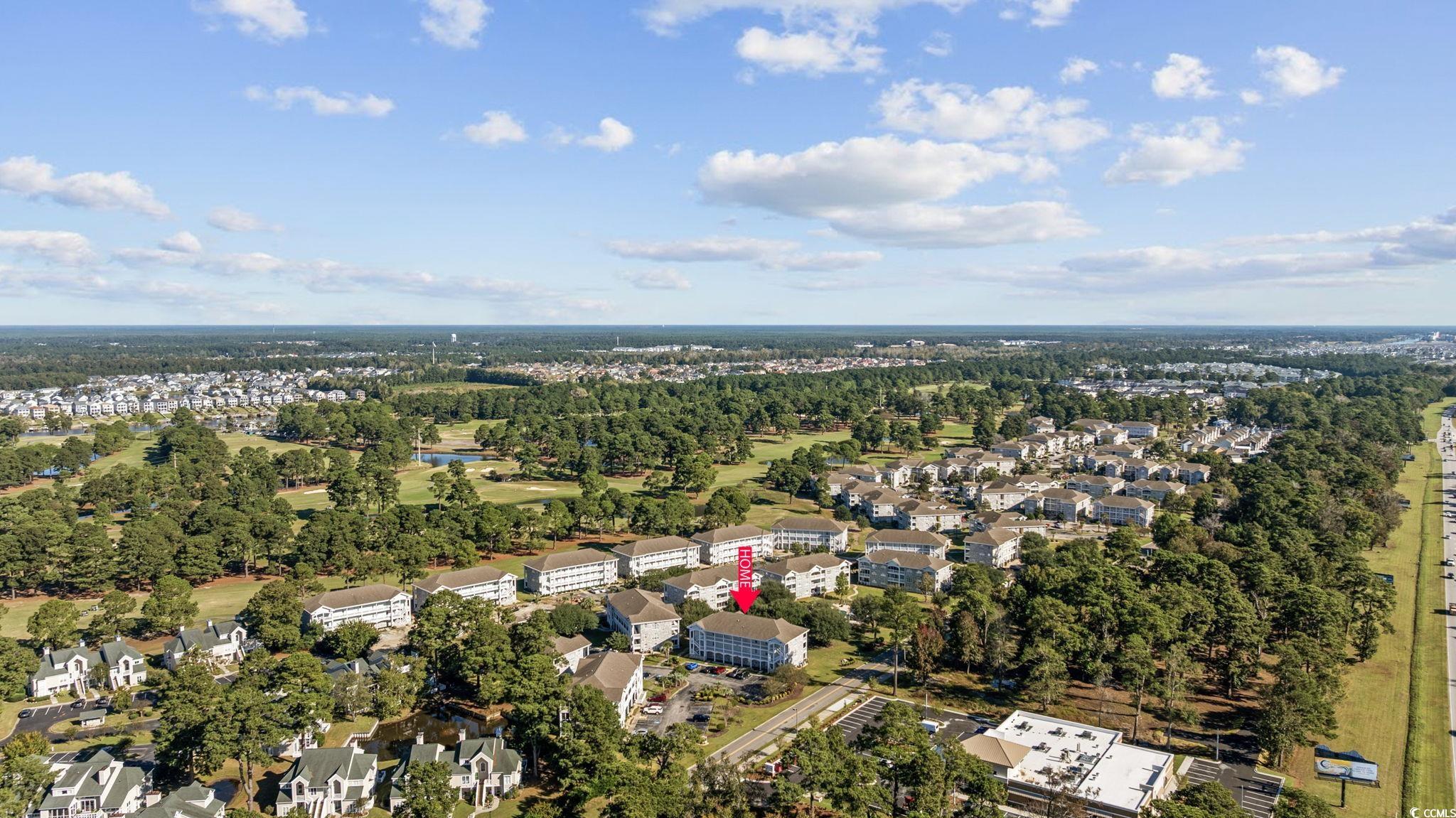 4639 Wild Iris Drive, Unit 203 Myrtle Beach, SC 29577 - Photo 27 of 30 Aerial overview of property's location featuring a tree filled landscape and nearby suburban area
