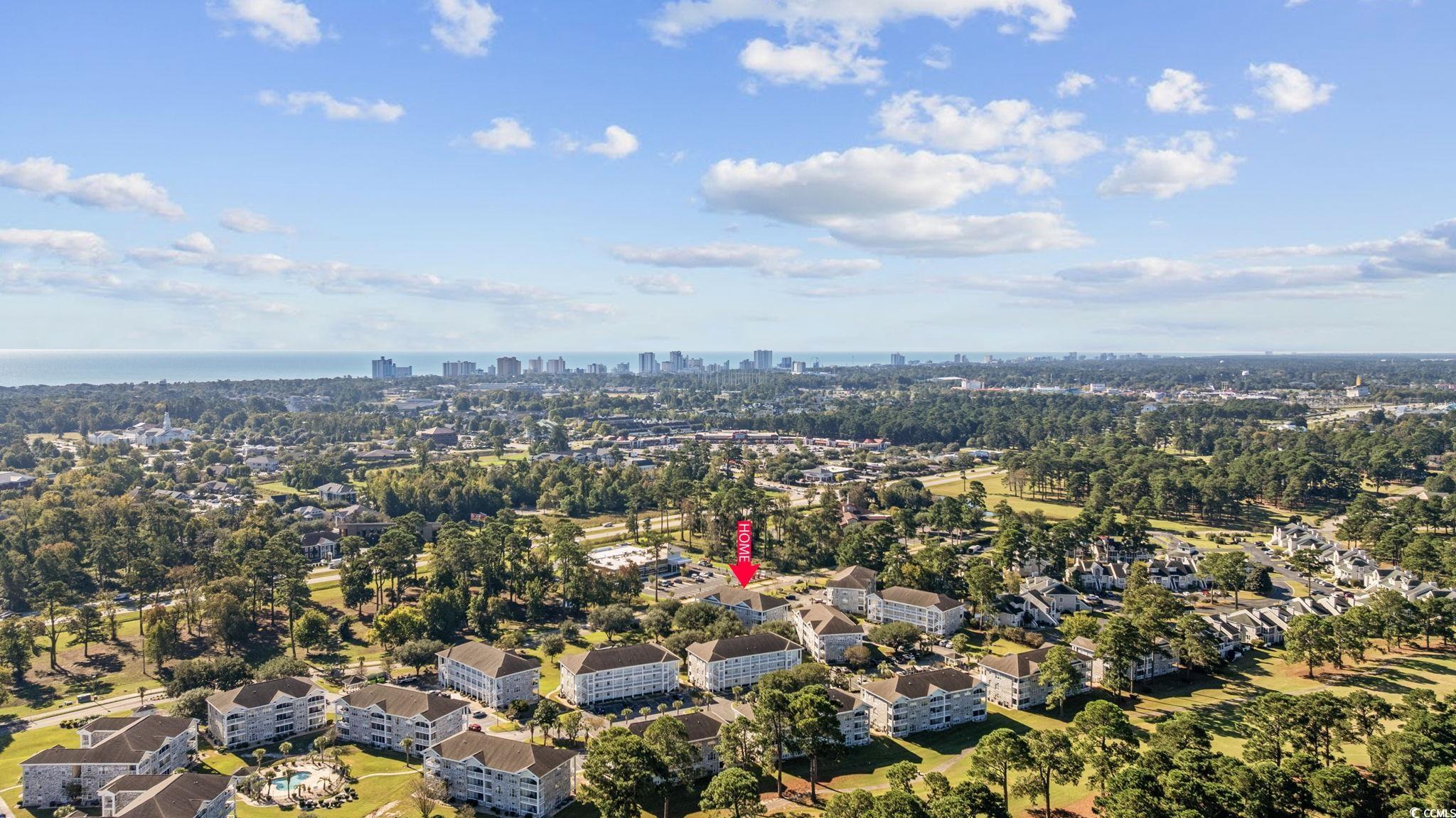 4639 Wild Iris Drive, Unit 203 Myrtle Beach, SC 29577 - Photo 29 of 30 View of property location featuring city skyline and a tree filled landscape