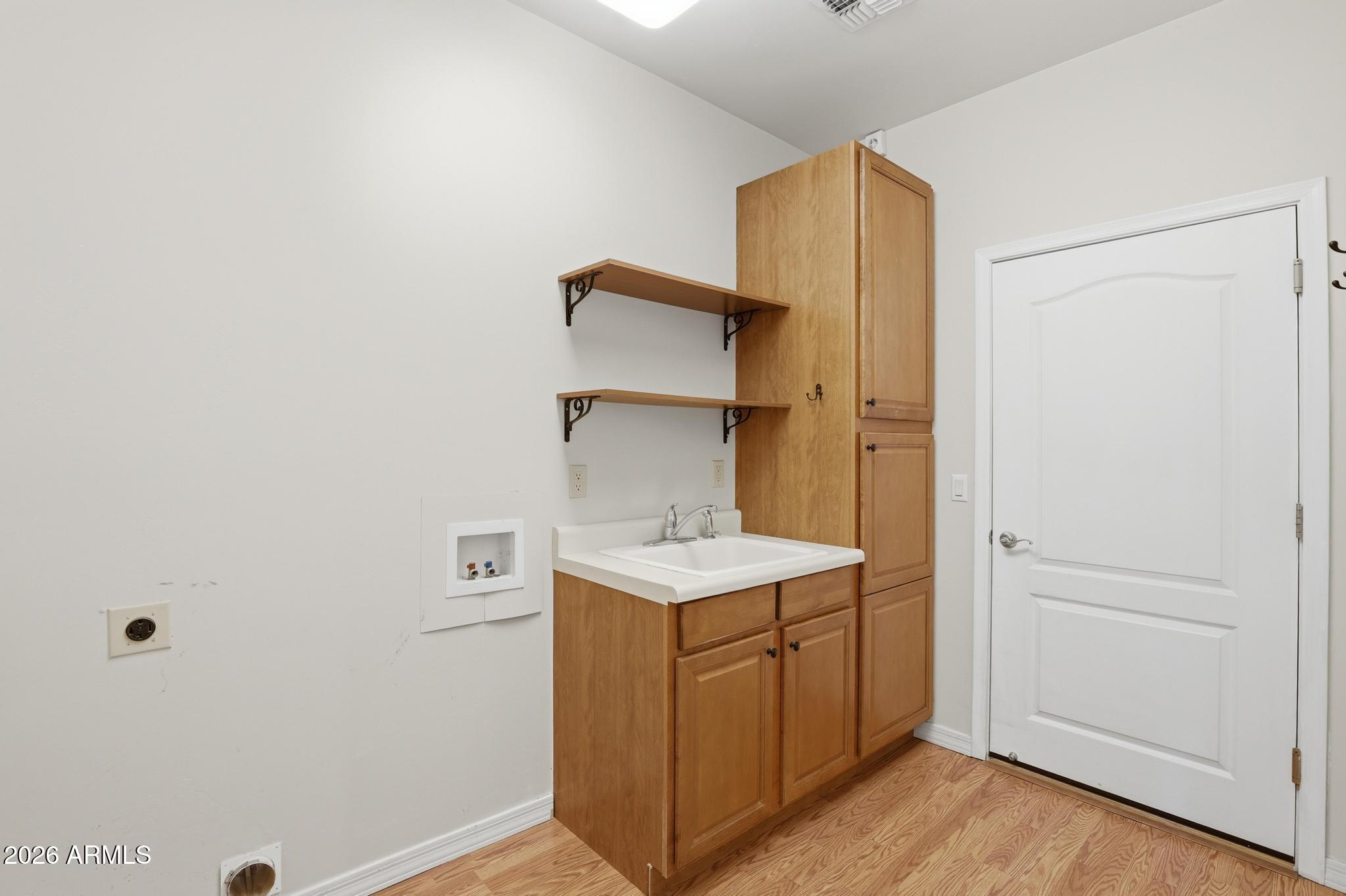 408 East Phoenix Street Payson, AZ 85541 - Photo 23 of 35 a utility room with cabinets washer and dryer