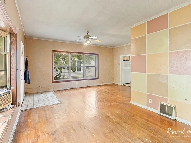 a view of an empty room with a window
