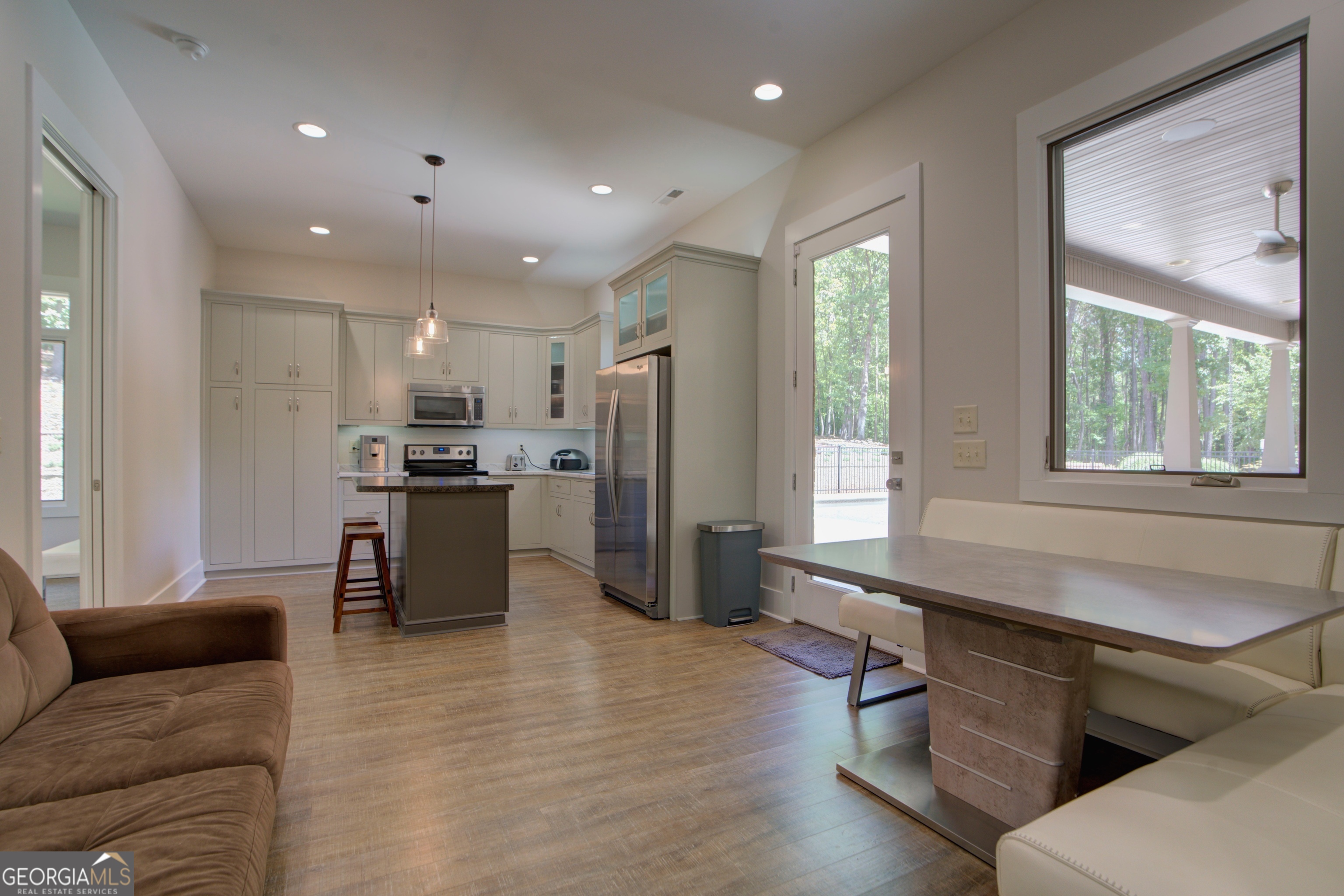 610 Kings Bridge Road Cave Spring, GA 30124 - Photo 36 of 72 a kitchen with stainless steel appliances kitchen island granite countertop a refrigerator oven a sink a dining table and chairs