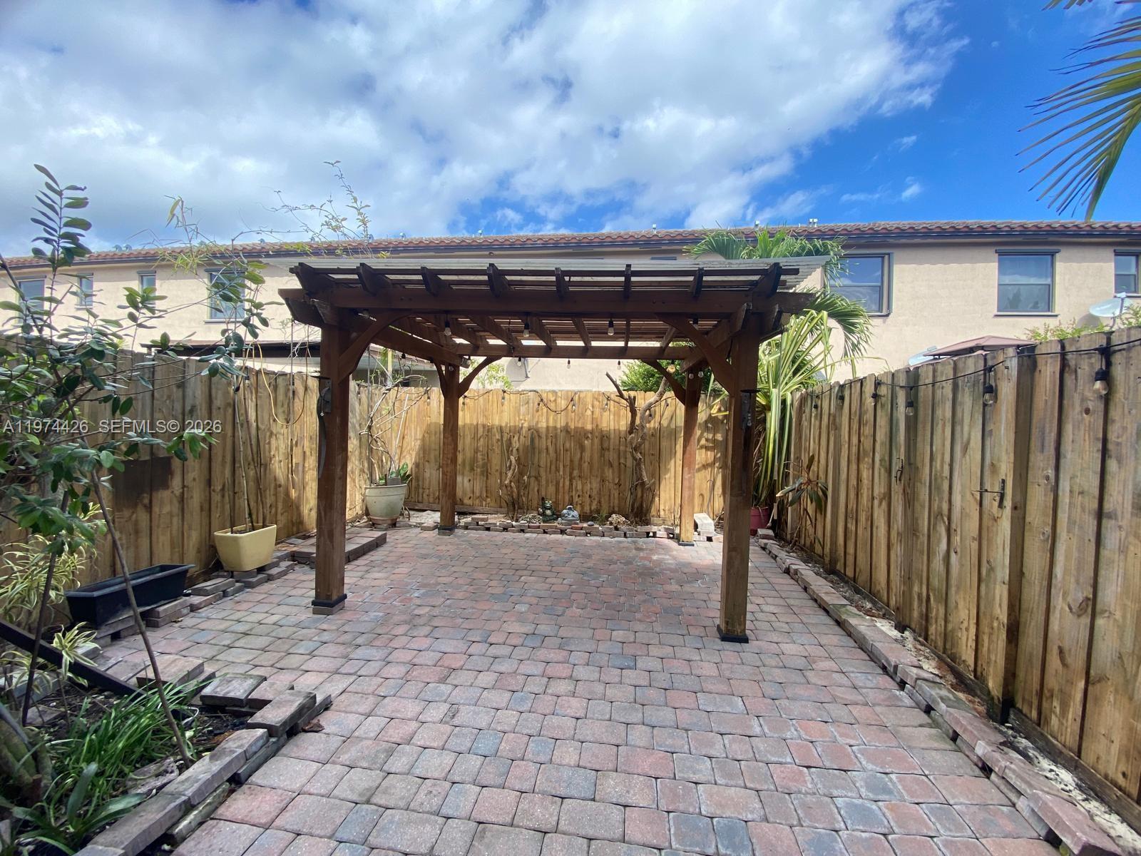 11543 Southwest 248th Lane Homestead, FL 33032 - Photo 13 of 32 a view of a patio