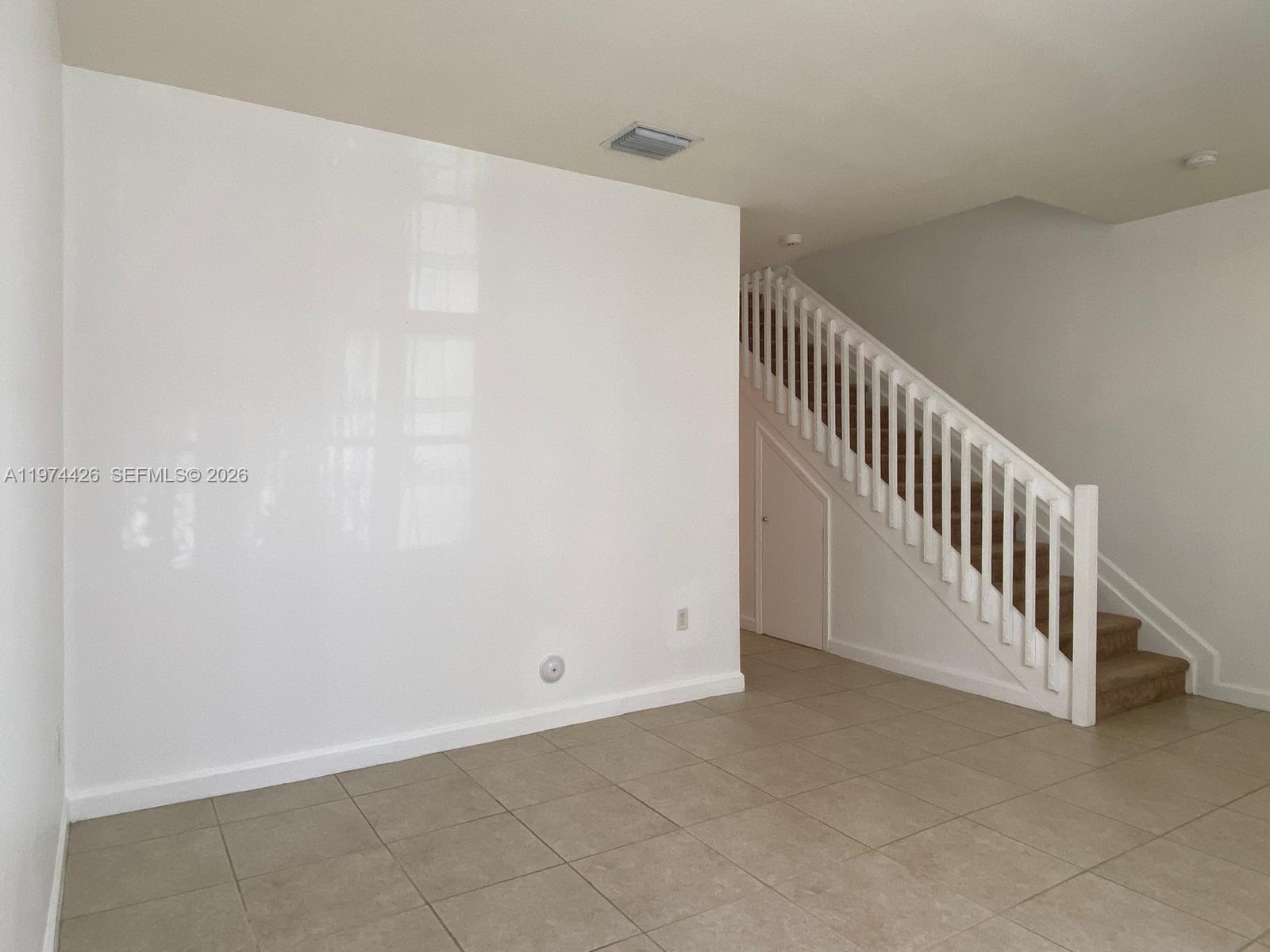11543 Southwest 248th Lane Homestead, FL 33032 - Photo 17 of 32 a view of a hallway with staircase