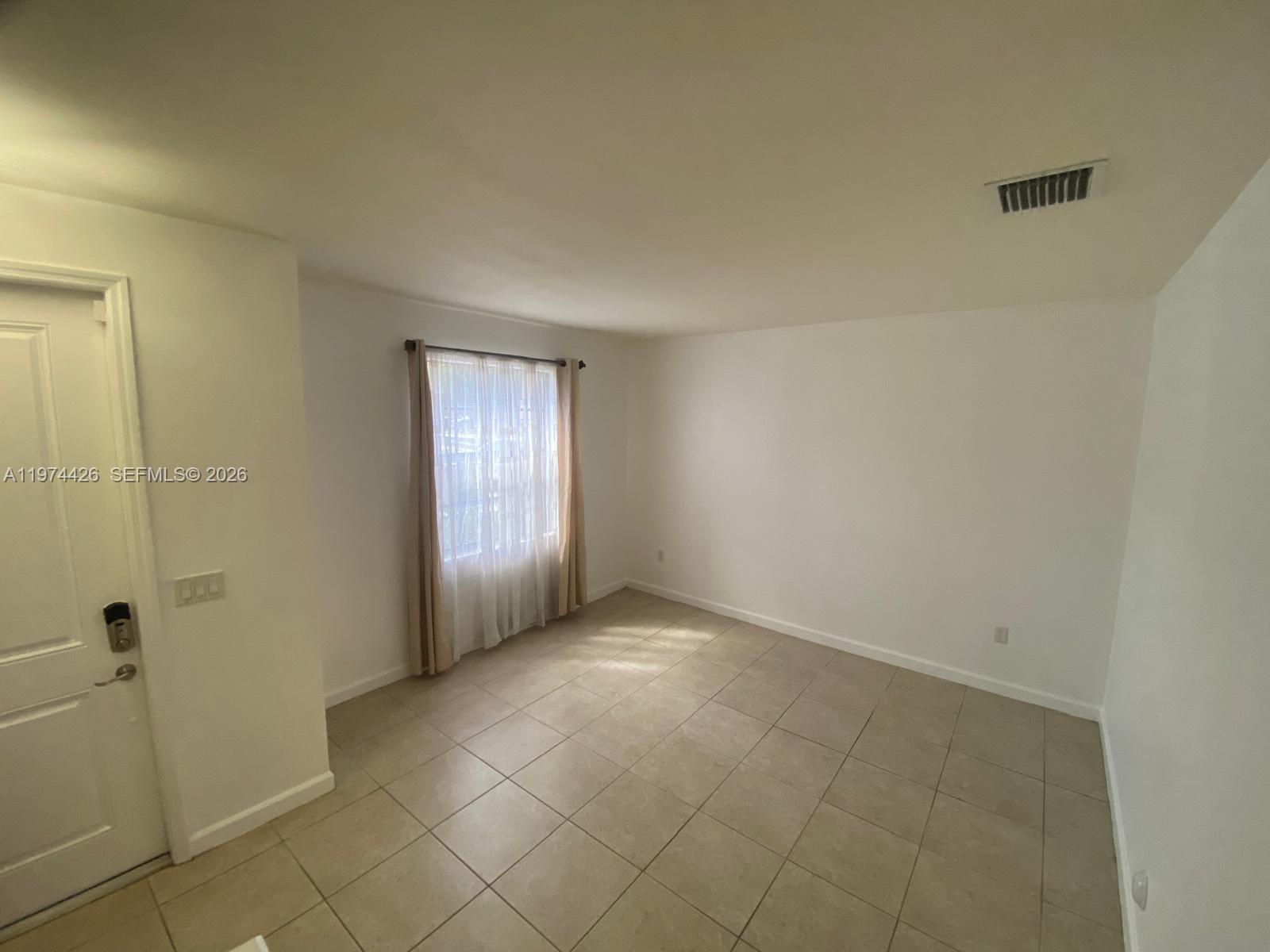 11543 Southwest 248th Lane Homestead, FL 33032 - Photo 18 of 32 a view of an empty room and window
