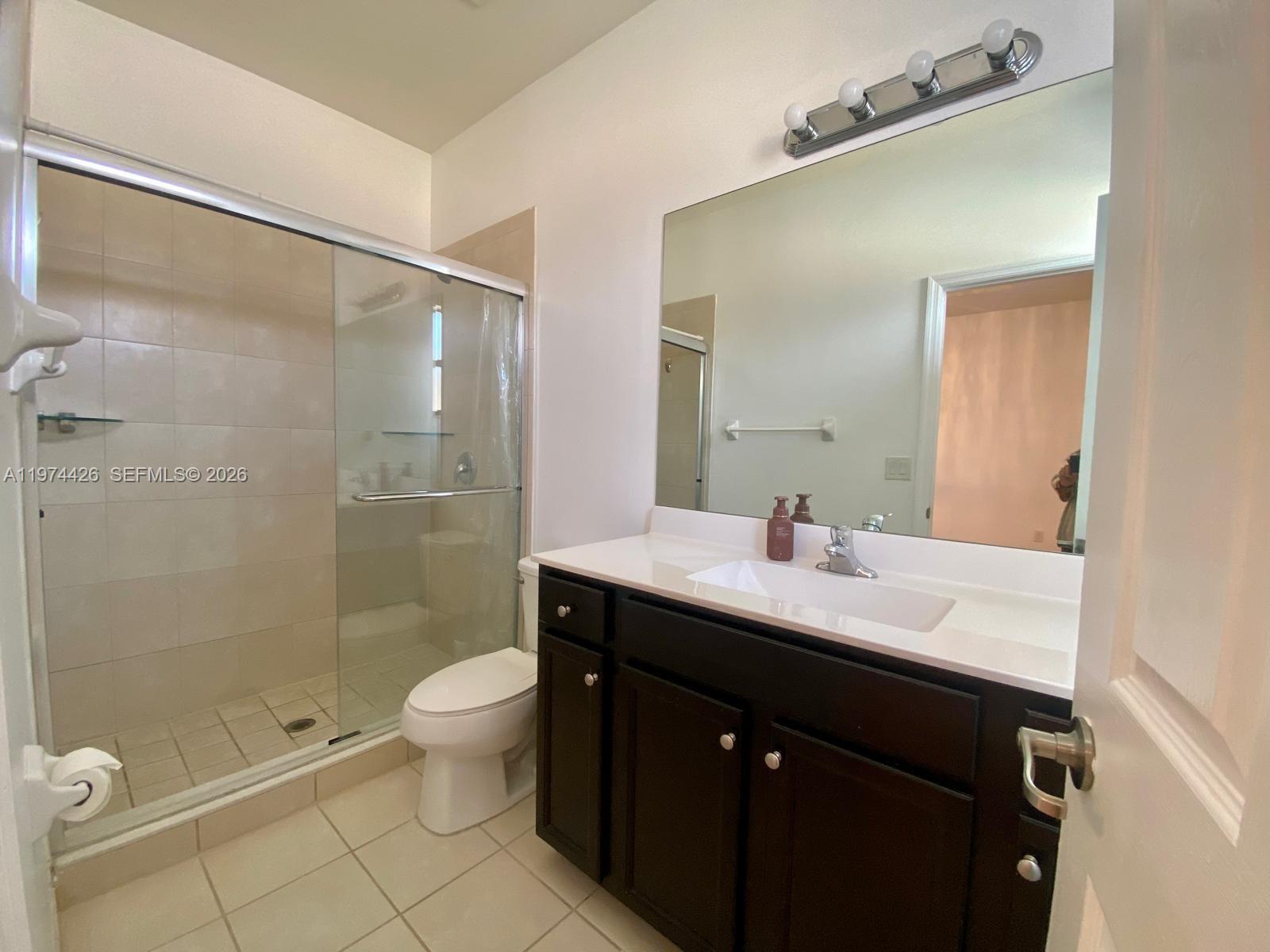 11543 Southwest 248th Lane Homestead, FL 33032 - Photo 20 of 32 a bathroom with a sink a toilet and shower