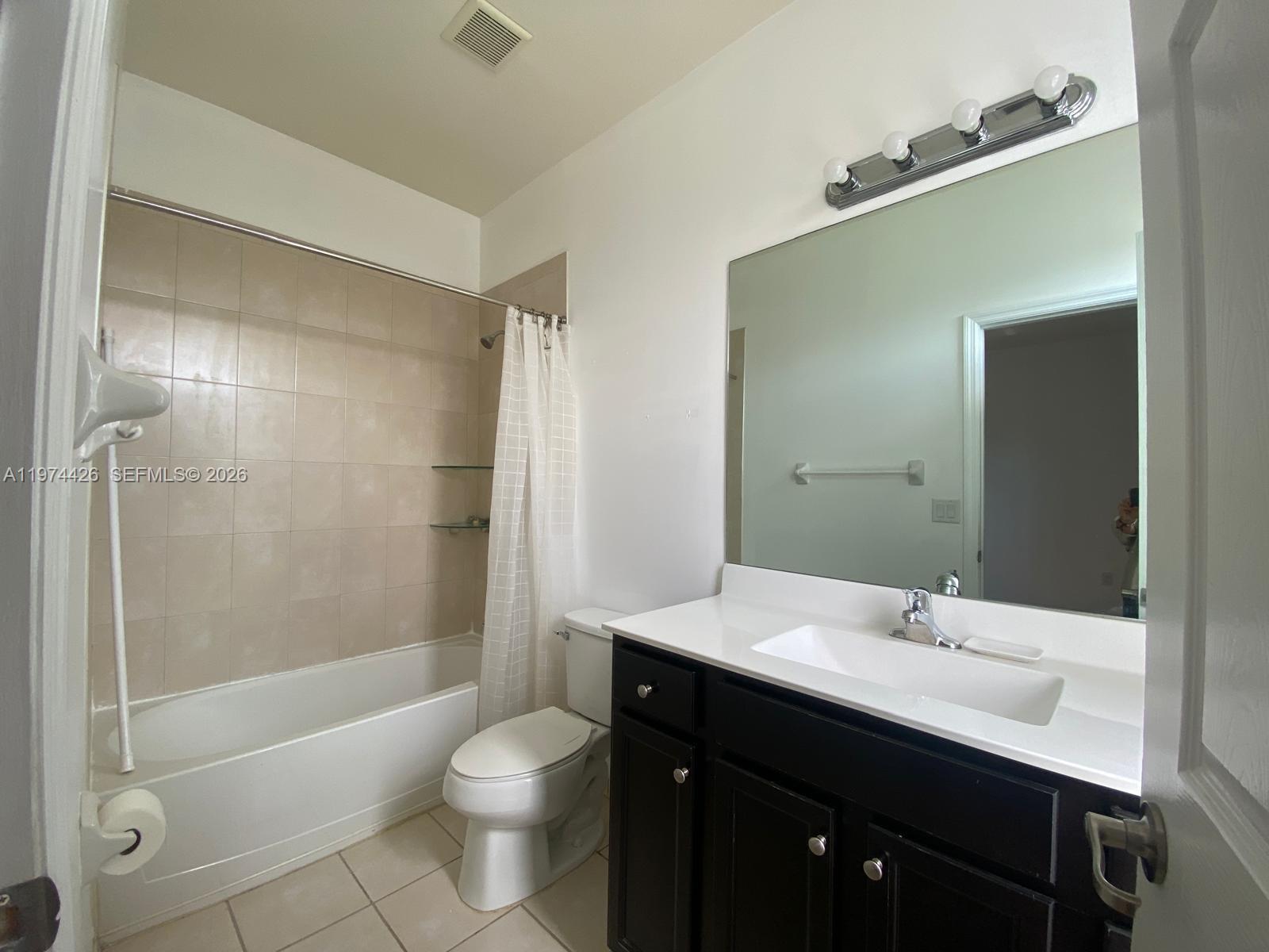 11543 Southwest 248th Lane Homestead, FL 33032 - Photo 23 of 32 a bathroom with a sink a toilet and shower