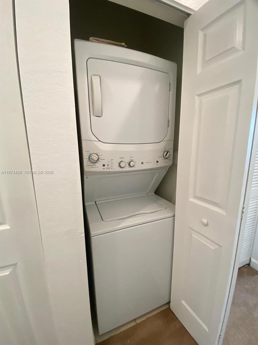 11543 Southwest 248th Lane Homestead, FL 33032 - Photo 24 of 32 a utility room with dryer and washer