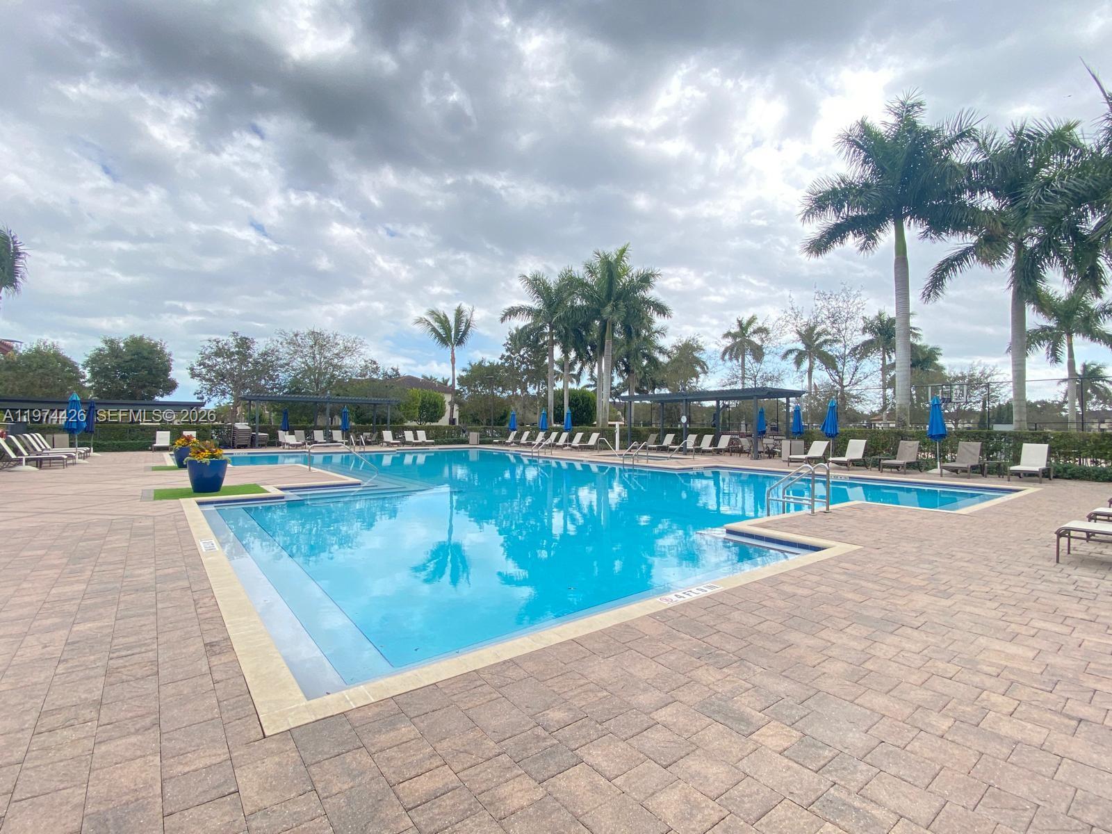 11543 Southwest 248th Lane Homestead, FL 33032 - Photo 25 of 32 a view of swimming pool and trees in th background