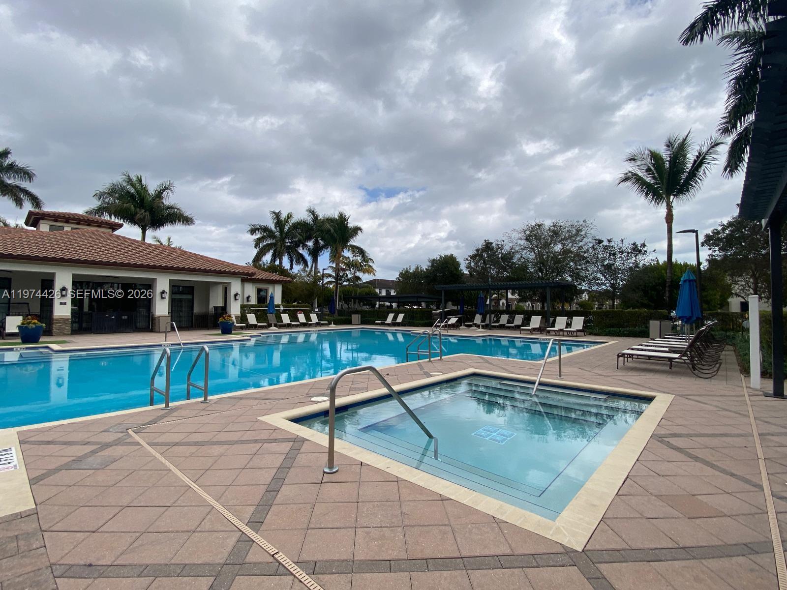 11543 Southwest 248th Lane Homestead, FL 33032 - Photo 26 of 32 a view of a house with swimming pool and sitting area
