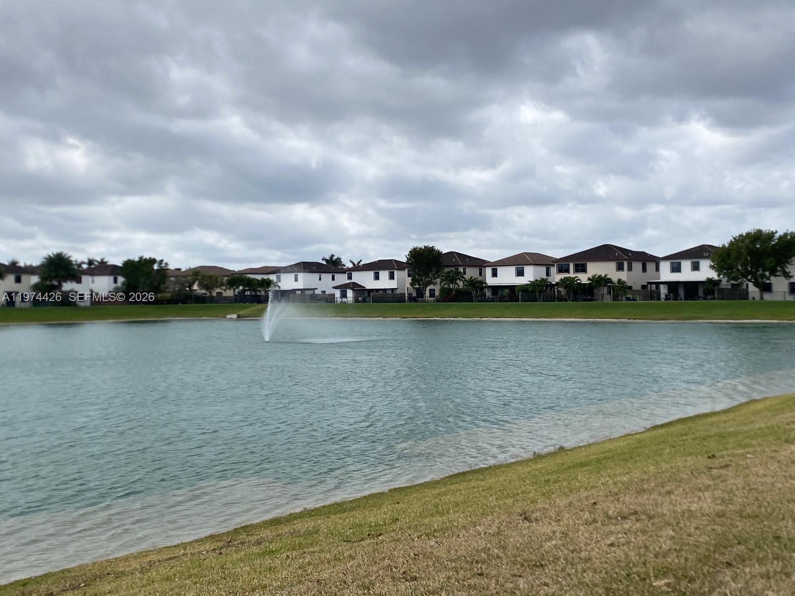 11543 Southwest 248th Lane Homestead, FL 33032 - Photo 32 of 32 a view of a lake with houses in the back