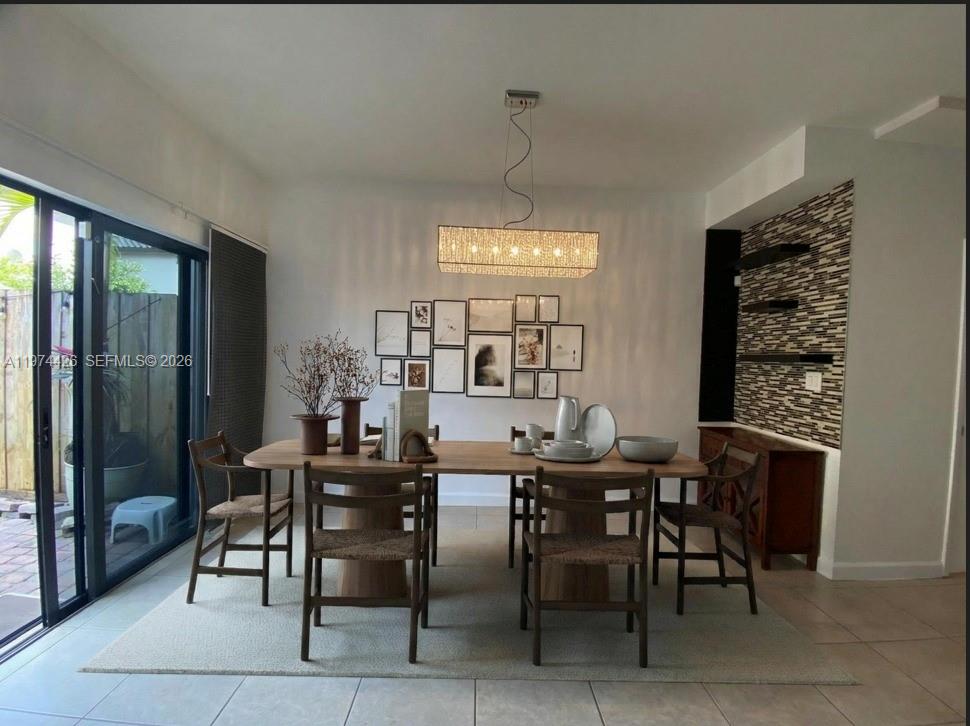 11543 Southwest 248th Lane Homestead, FL 33032 - Photo 5 of 32 a view of a dining room with furniture window and outside view