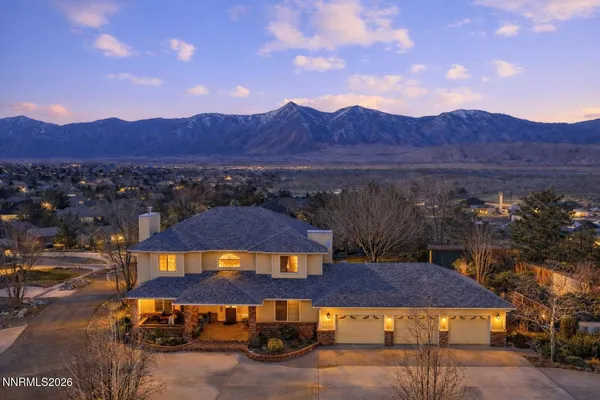 an aerial view of a house with a ocean view