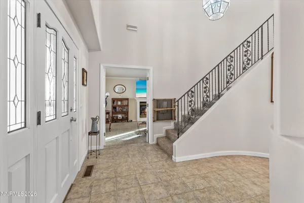a view of an entryway with wooden floor