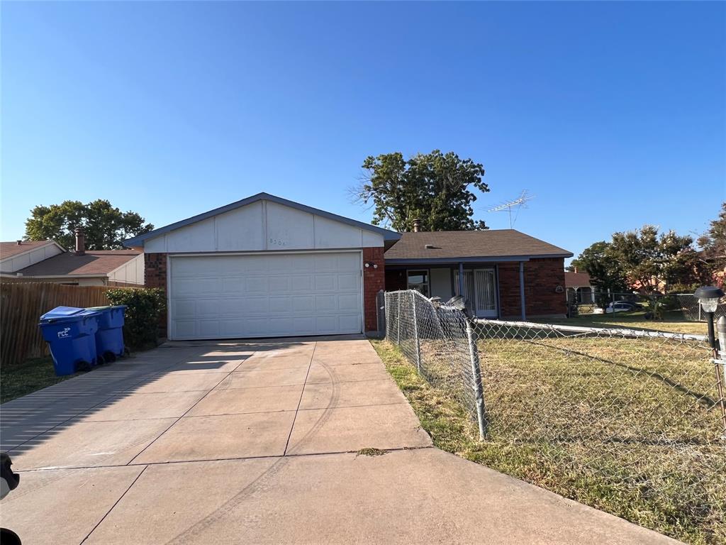 8506 Woodside Road Rowlett, TX 75088 - Photo 24 of 27 a backyard of a house with table and chairs