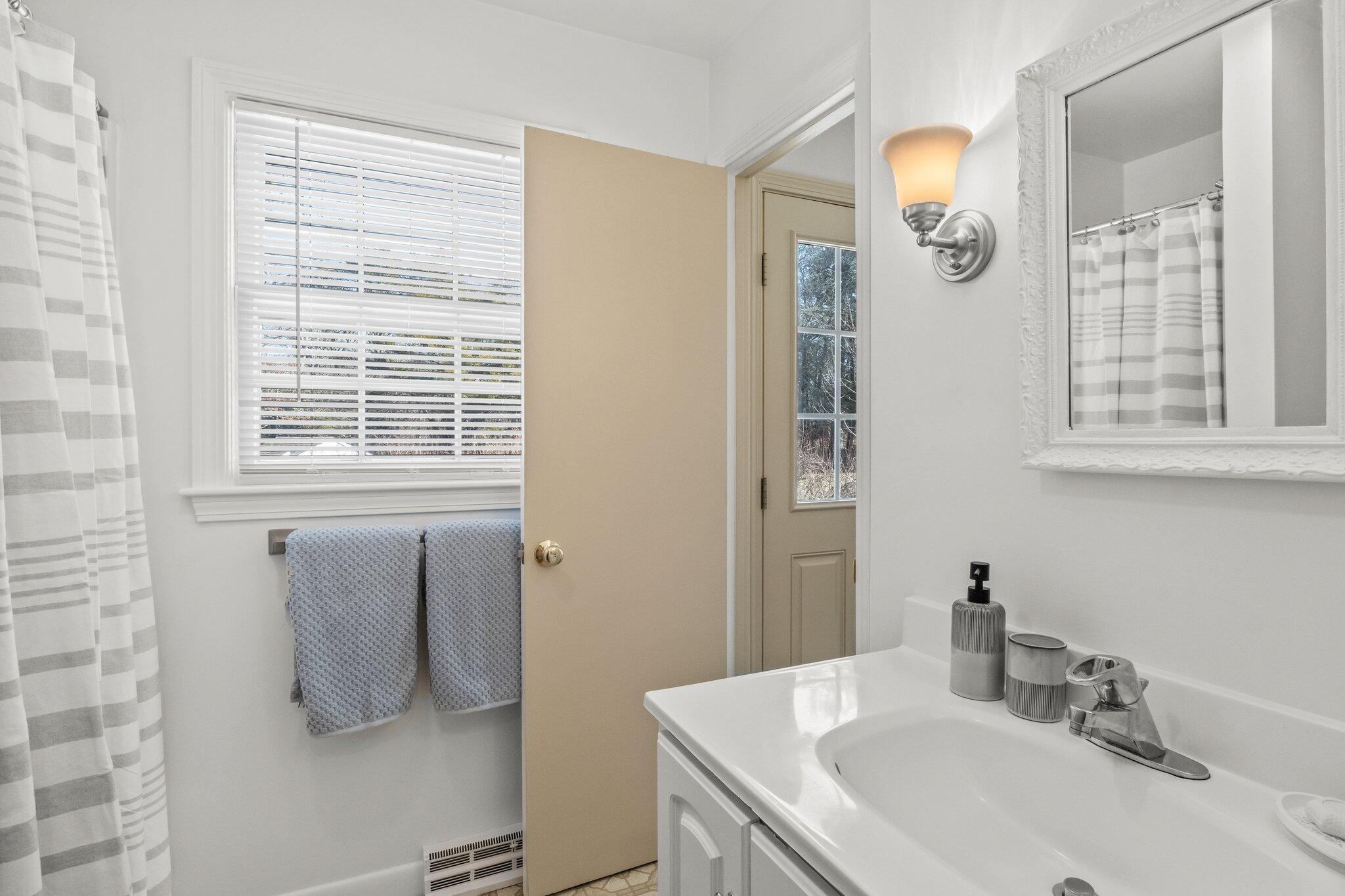 2 Long Road Harwich, MA 02645 - Photo 13 of 34 a bathroom with a sink and a mirror