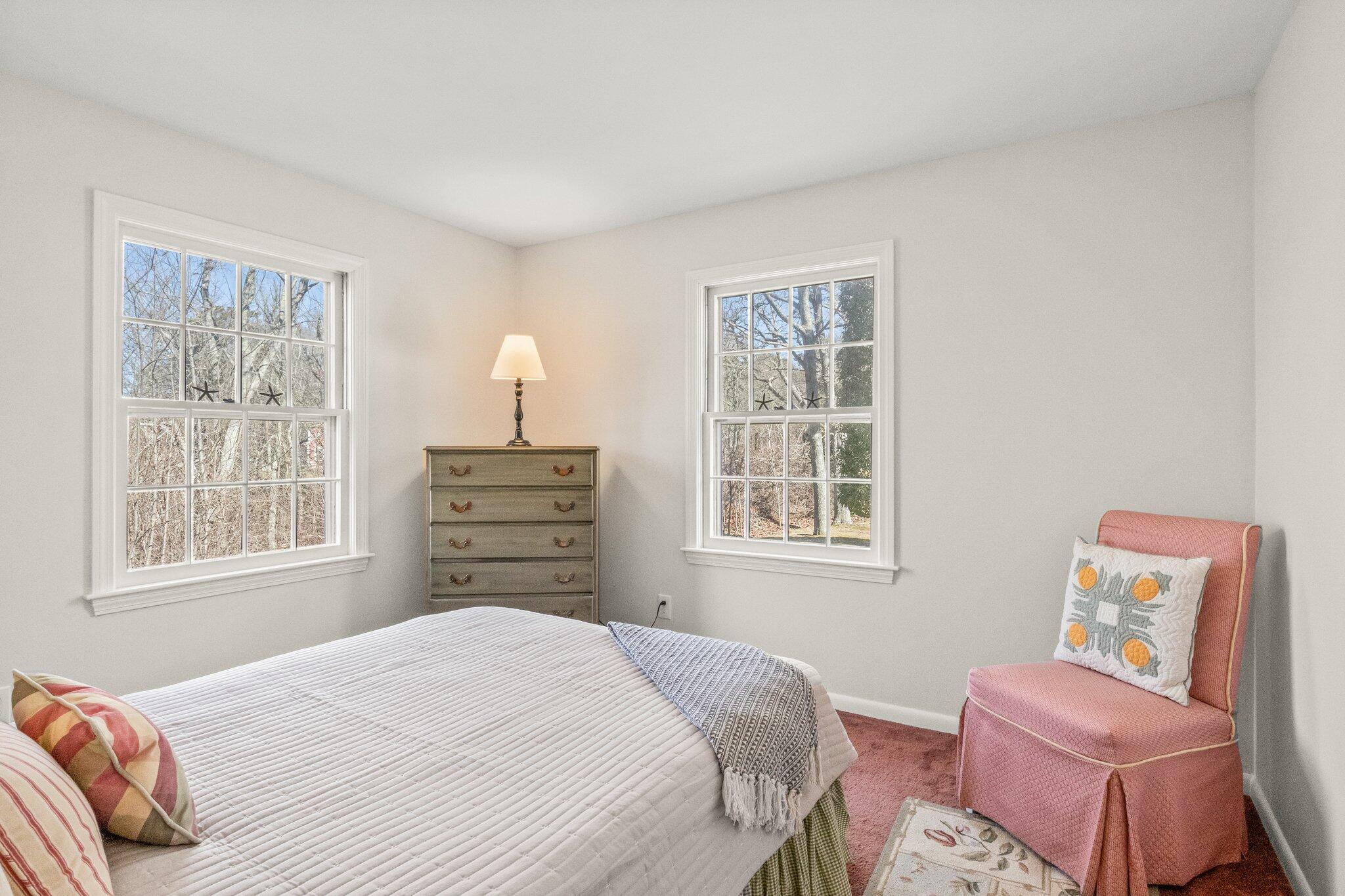 2 Long Road Harwich, MA 02645 - Photo 14 of 34 a bedroom with a bed dresser and a window
