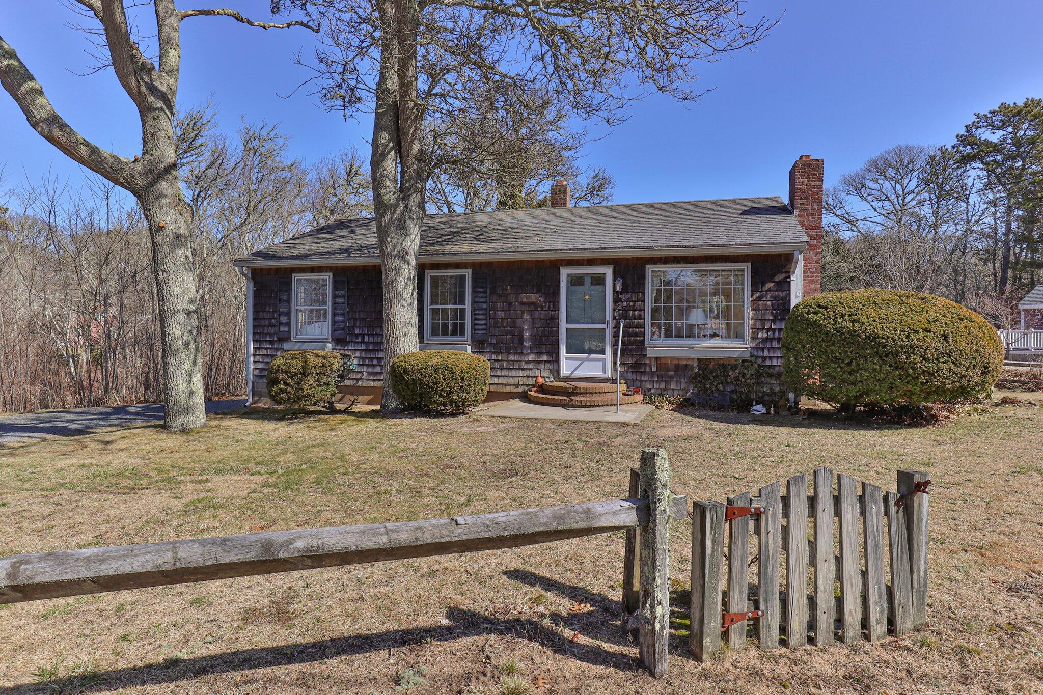 2 Long Road Harwich, MA 02645 - Photo 2 of 34 a front view of a house with garden