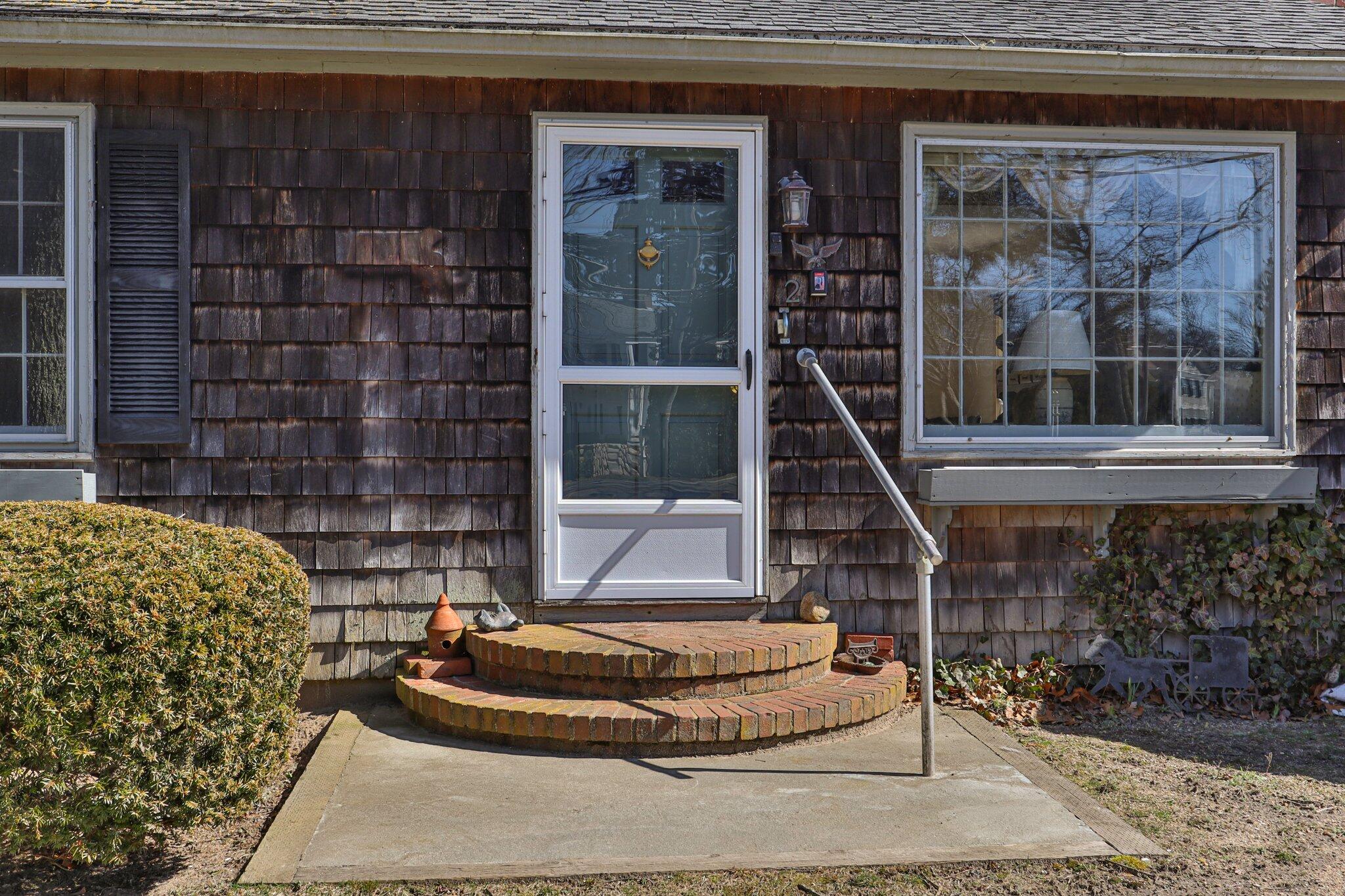 2 Long Road Harwich, MA 02645 - Photo 3 of 34 a room with a couch and a potted plant