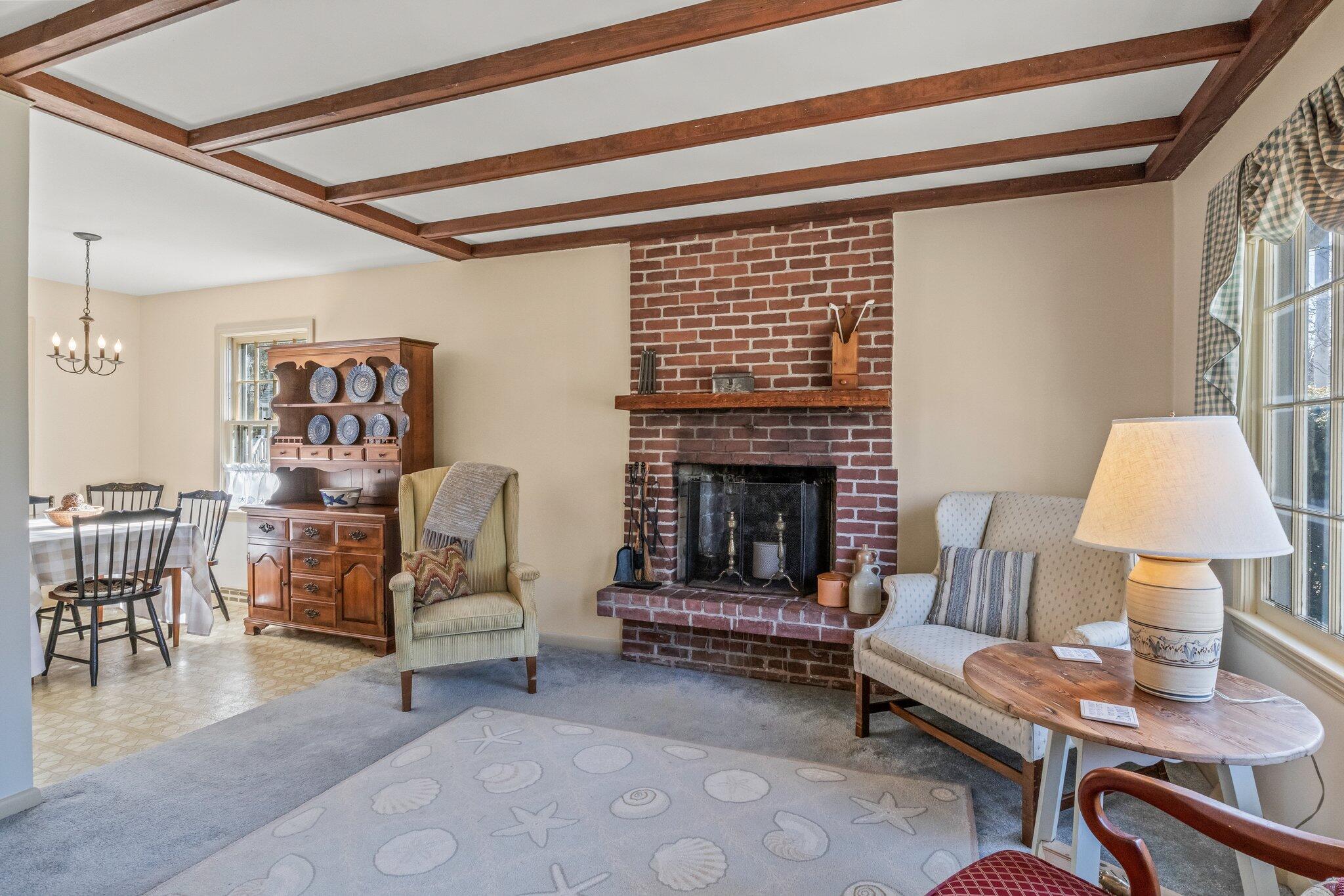 2 Long Road Harwich, MA 02645 - Photo 5 of 34 a living room with furniture and a fireplace