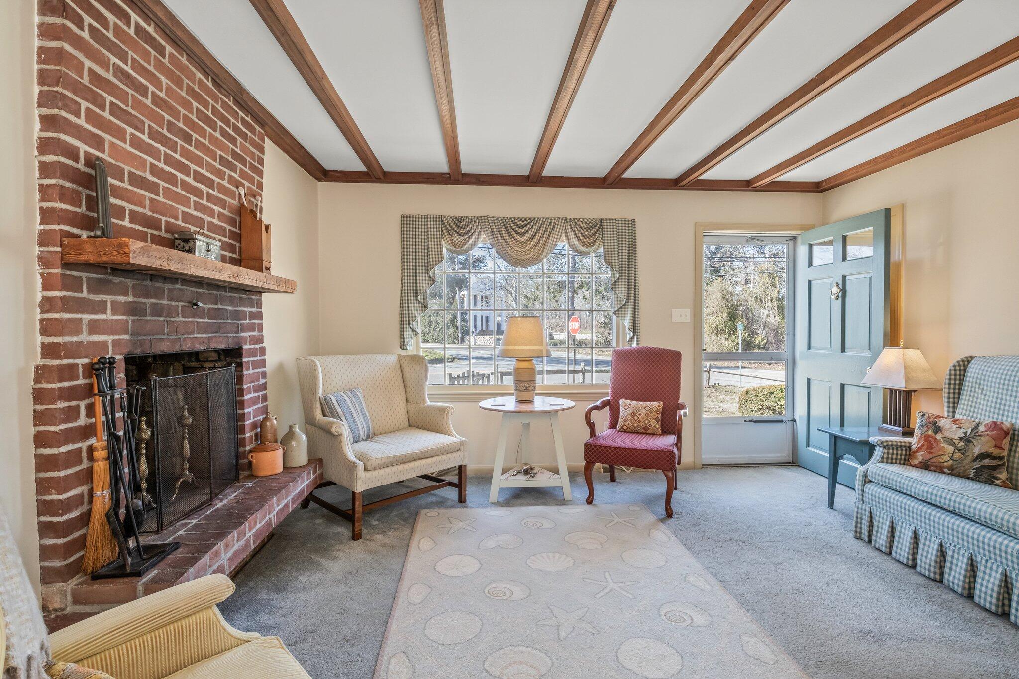 2 Long Road Harwich, MA 02645 - Photo 6 of 34 a living room with furniture and a fireplace