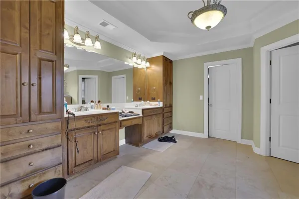 a bathroom with a double vanity sink mirror and shower