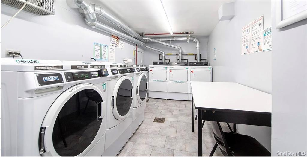 241-20 Northern Boulevard, Unit 4C Queens, NY 11362 - Photo 12 of 12 a utility room with dryer and washer