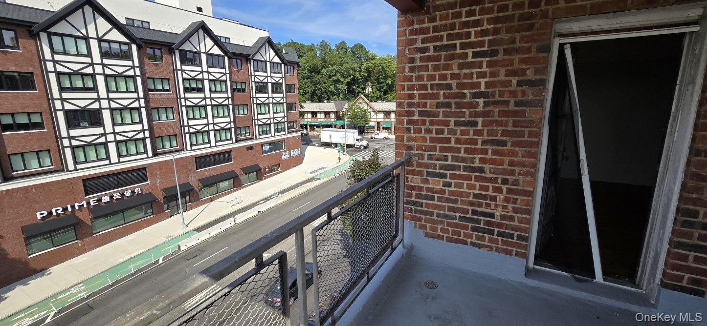 241-20 Northern Boulevard, Unit 4C Queens, NY 11362 - Photo 2 of 12 a balcony with street view
