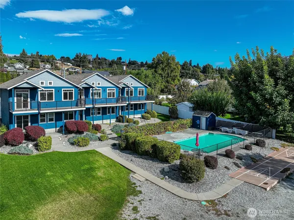 a front view of a house with garden and porch