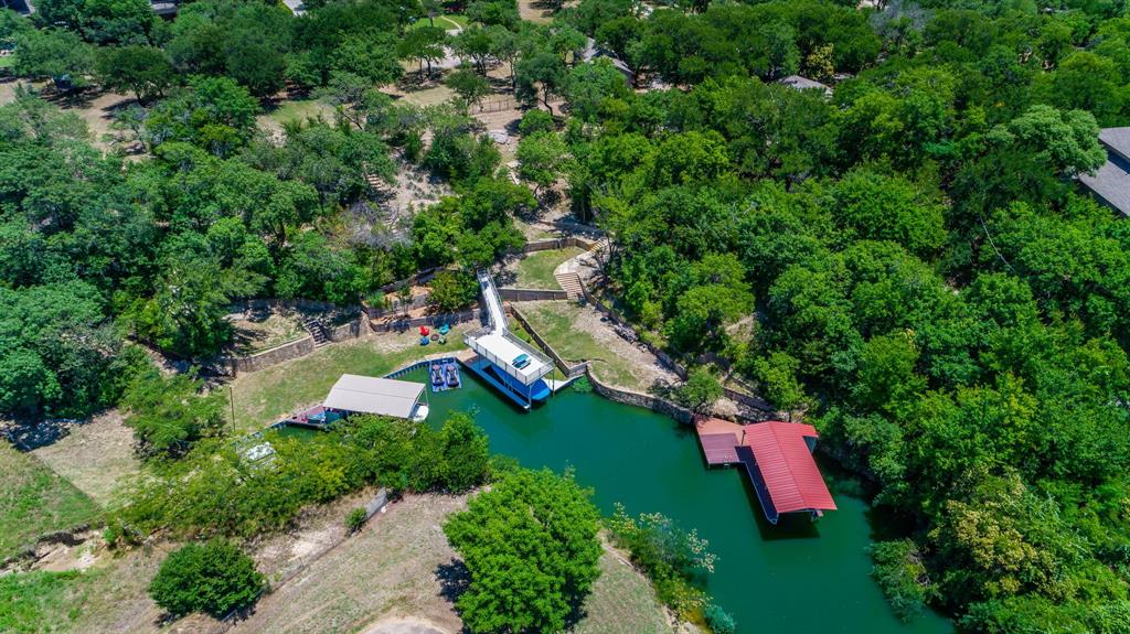 9525 Dickson Road Fort Worth, TX 76179 - Photo 1 of 1 an aerial view of a house with a yard and lake view
