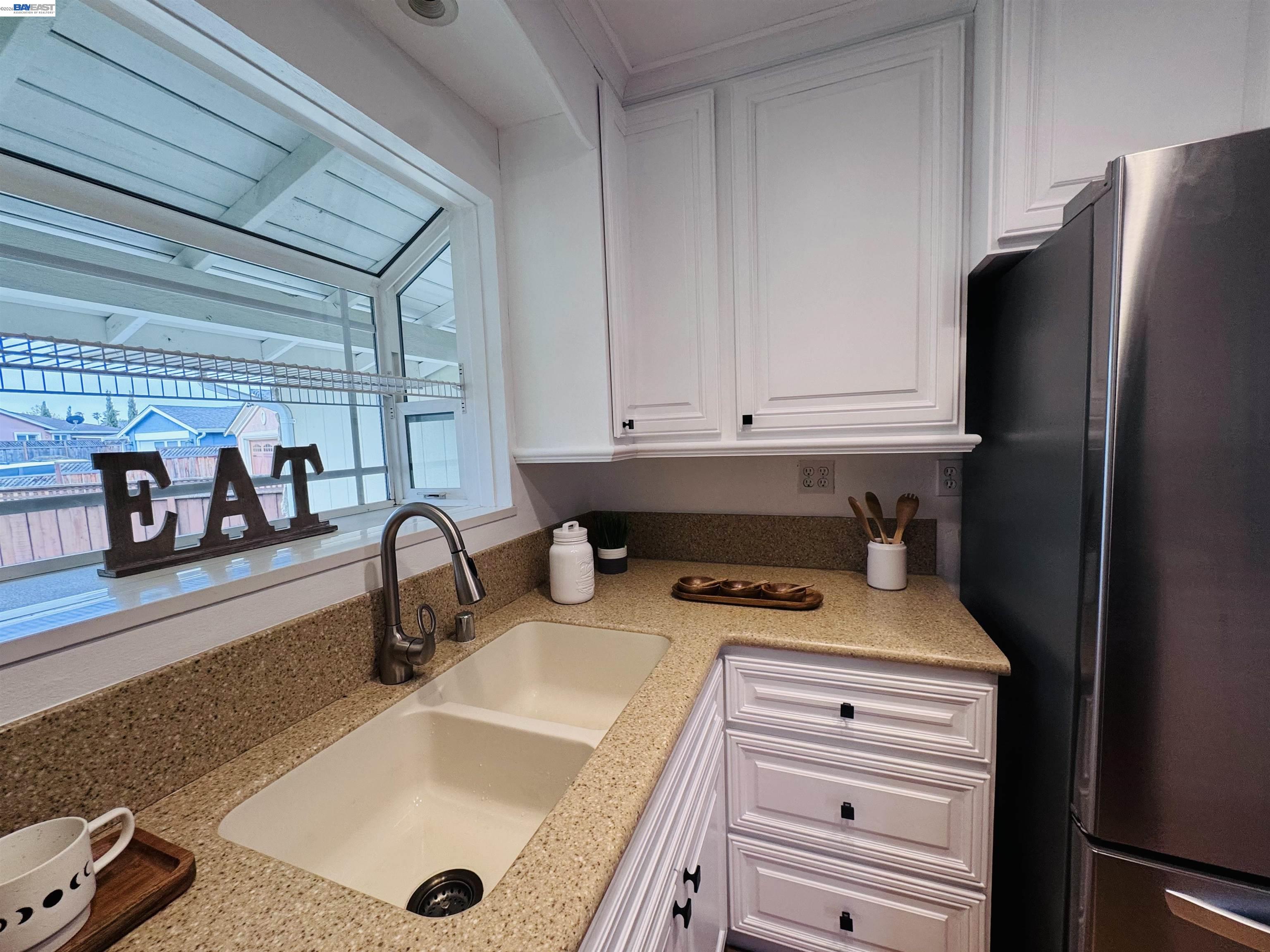 32301 Ruth Court Union City, CA 94587 - Photo 20 of 32 a kitchen with a refrigerator and a stove top oven