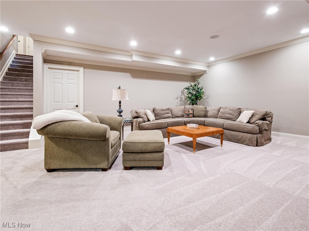 5349 Slater Ridge Westerville, OH 43082 - Photo 34 of 50 Carpeted living area featuring recessed lighting, ornamental molding, and stairway