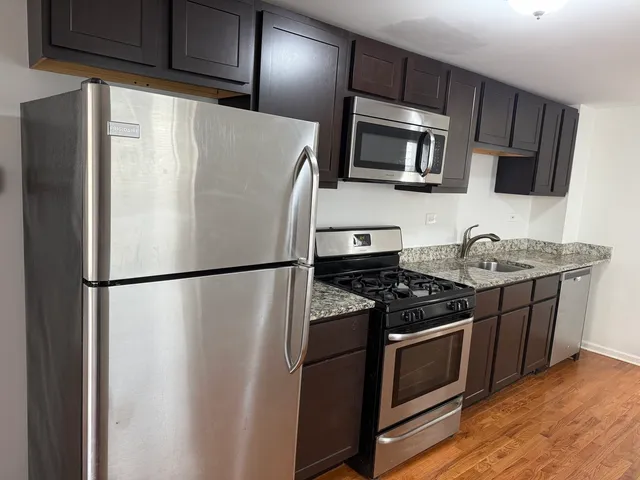 a white refrigerator freezer sitting in a kitchen