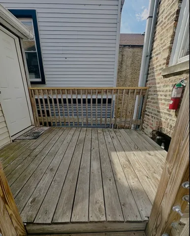 a view of balcony with wooden floor