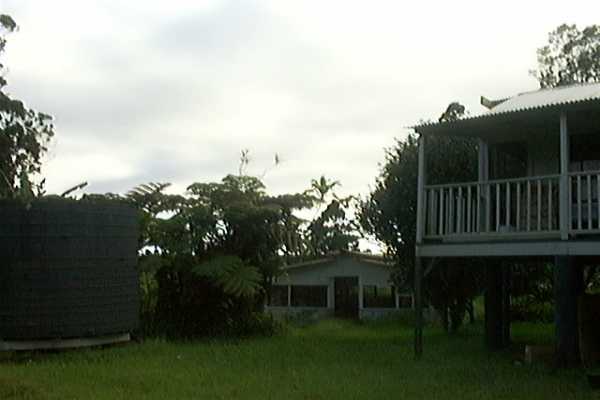 18-2505 Volcano Road Mountain View, HI 96771 - Photo 3 of 13 a view of house with backyard porch and entertaining space
