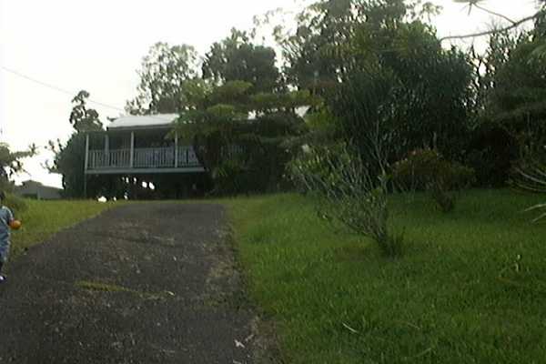 18-2505 Volcano Road Mountain View, HI 96771 - Photo 4 of 13 a view of house with a big yard