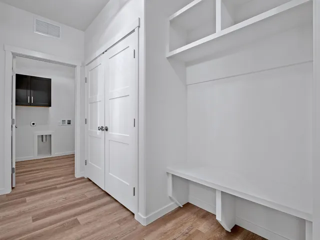 a view of a livingroom with wooden floor