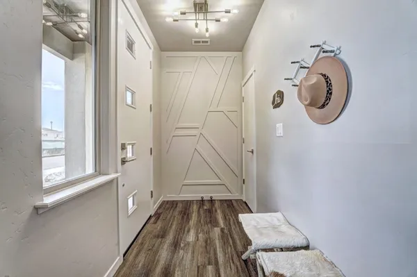 a bathroom with a granite countertop shower a sink and a mirror