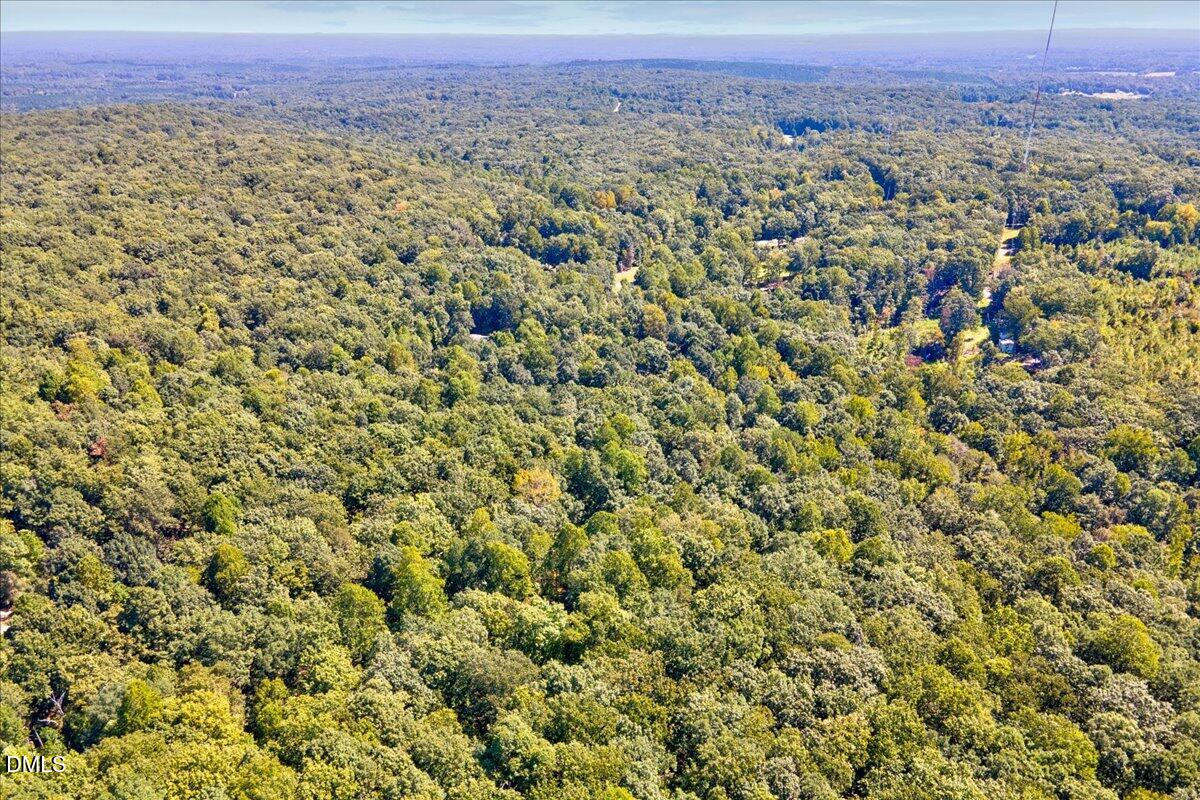 0 Boulder Road Snow Camp, NC 27349 - Photo 8 of 10 a view of a city with lush green hillside