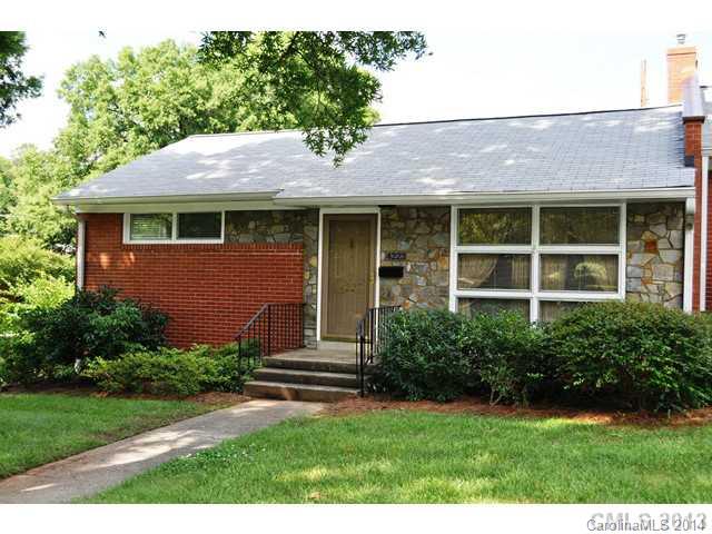4223 Cheltenham Road, Unit 4223 Charlotte, NC 28211 - Photo 1 of 16 a front view of a house with a garden